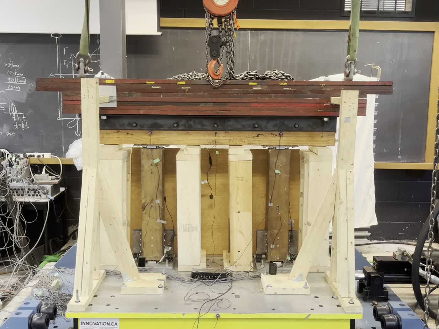 Steel plates and viscoelastic dampers at the rocking interface